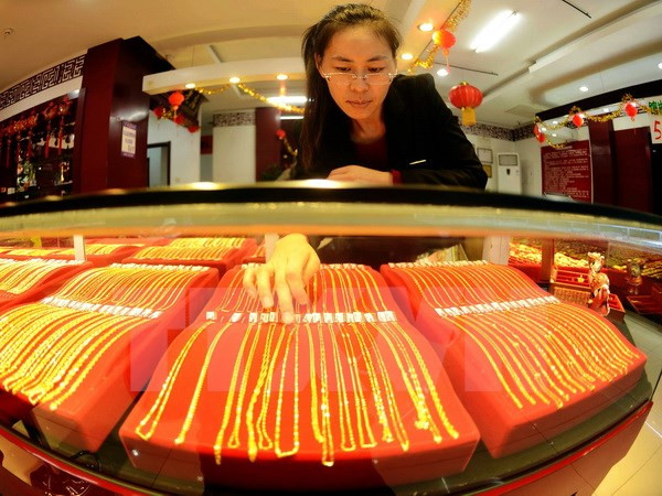 Giá vàng châu Á trượt xuống mức thấp nhất của hai tuần ảnh 1