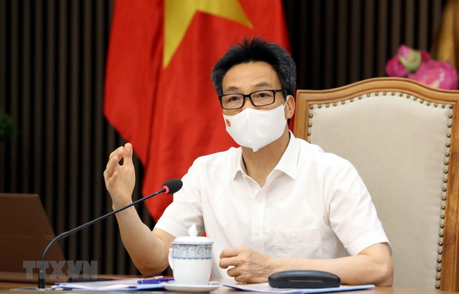 Phó Thủ tướng Chính phủ Vũ Đức Đam. (Ảnh: Phạm Kiên/TTXVN) Cần điều chỉnh hành vi, kiểm soát tốt dịch sống chung an toàn ảnh 2