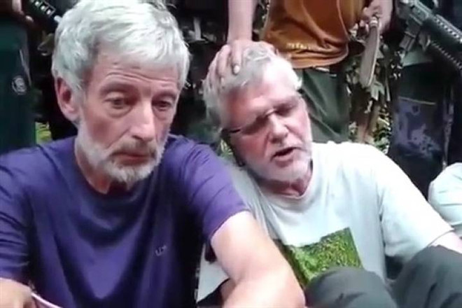 Hai con tin người Canada ở Philippines bị đe dọa chặt đầu ảnh 1