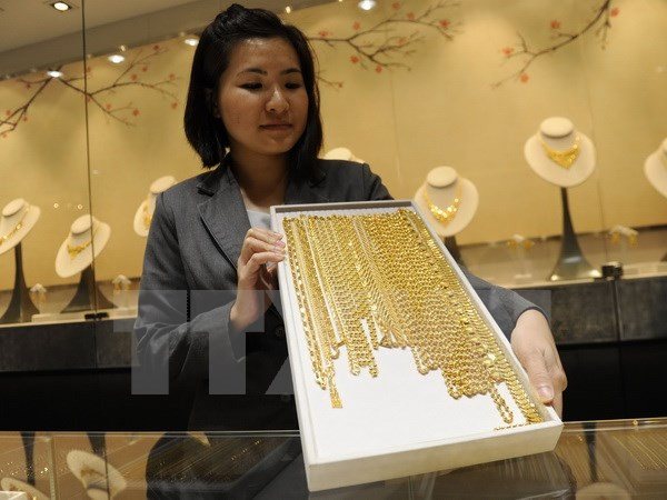 Giá vàng thế giới đi xuống do đồng USD và chứng khoán đi lên ảnh 1