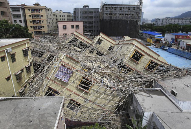 Sập nhà ở Trung Quốc, lở đất Uganda gây nhiều thương vong ảnh 1