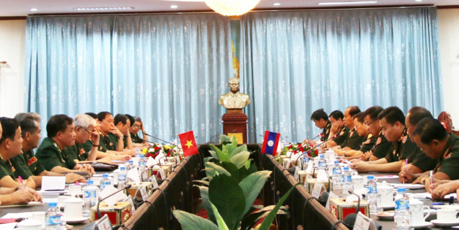 Quang cảnh buổi Hội đàm. (Ảnh: Xuân Tú/TTXVN) Trao đổi chính sách quốc phòng Việt Nam-Lào lần thứ nhất ảnh 1