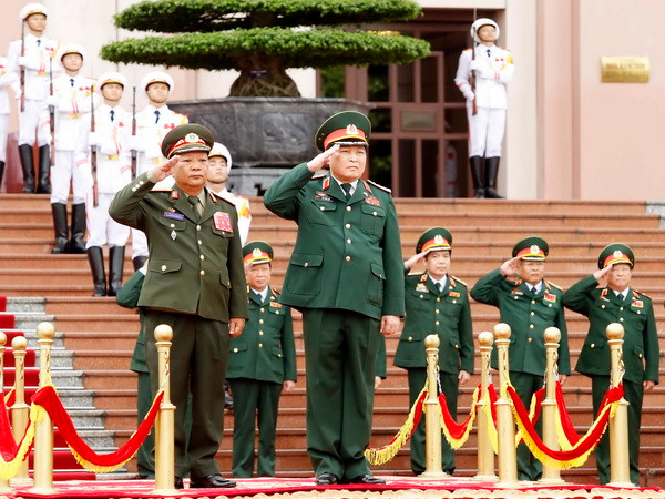Đính chính tin Tăng cường hợp tác quốc phòng giữa hai nước Việt-Lào ảnh 1