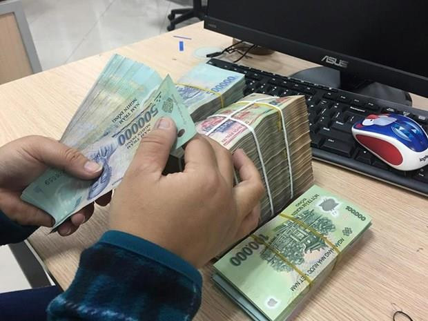 Tập đoàn Điện lực Việt Nam sẽ thoái vốn 7,5% vốn điều lệ tại EVNFINANCE. (Ảnh minh họa. Nguồn: PV/Vietnam+) EVN sẽ thoái vốn 18,7 triệu cổ phần tại Công ty Tài chính Điện lực ảnh 1
