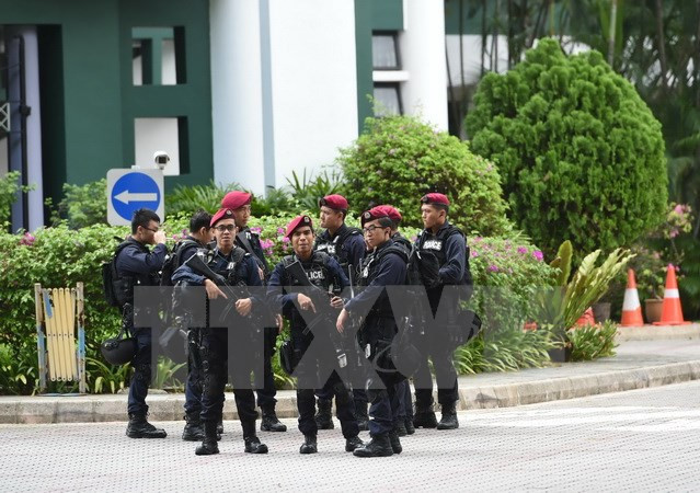 Cảnh sát Singapore. (Nguồn: AFP/TTXVN) Singapore bắt một cảnh sát có kế hoạch tham chiến tại Syria ảnh 1