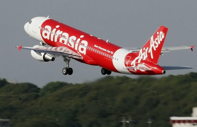 Một máy bay của hãng hàng không AirAsia. (Nguồn:Kyodo) Hãng Airbus cam kết hỗ trợ điều tra vụ máy bay QZ8501 mất tích ảnh 1