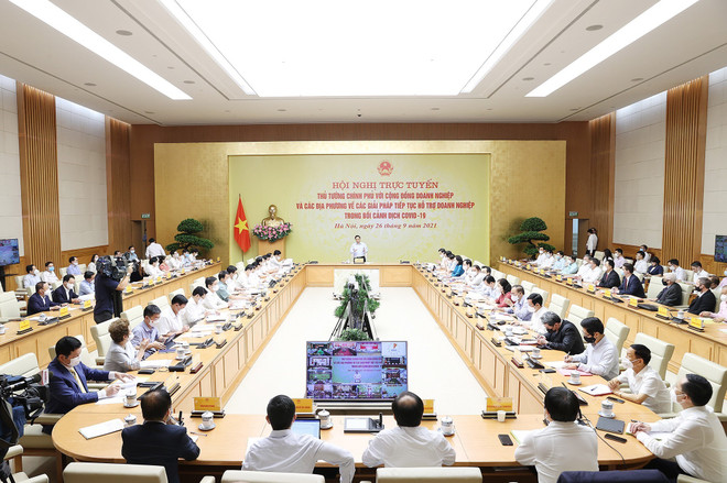Quang cảnh Hội nghị tại điểm cầu Trụ sở Chính phủ. (Ảnh: Dương Giang/TTXVN) Thủ tướng: Tập trung cải cách hành chính, chống gây sách nhiễu cho DN ảnh 2