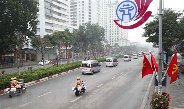 Đoàn xe đưa các biểu tới Trung tâm Hội nghị quốc gia. (Ảnh minh họa: TTXVN) Công tác bảo đảm an ninh, trật tự Đại hội XIII của Đảng được giữ vững ảnh 1