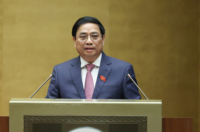 Thủ tướng Phạm Minh Chính trình bày Báo cáo kết quả thực hiện kế hoạch phát triển kinh tế-xã hội năm 2022; dự kiến kế hoạch phát triển kinh tế-xã hội năm 2023. (Ảnh: Dương Giang/TTXVN) Thúc đẩy tăng trưởng, bảo đảm các cân đối lớn của nền kinh tế ảnh 2