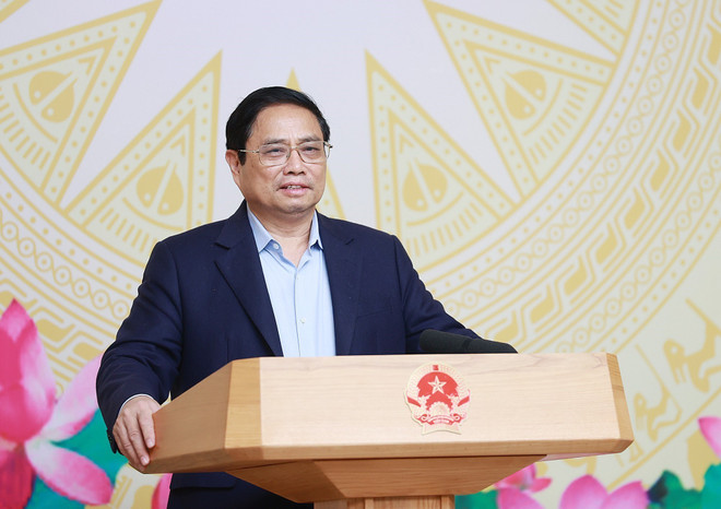 Thủ tướng Phạm Minh Chính phát biểu khai mạc phiên họp lần thứ 5 Ủy ban Quốc gia về chuyển đổi số. (Ảnh: Dương Giang/TTXVN) Thủ tướng: Nắm bắt công nghệ mới, đưa giải pháp phù hợp với Việt Nam ảnh 2