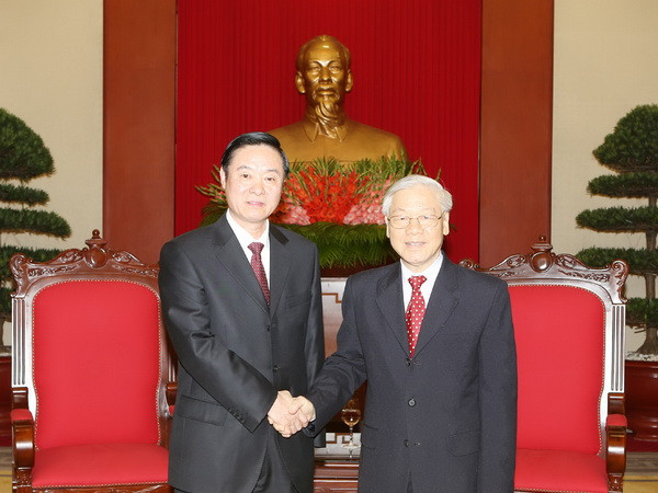 Tổng Bí thư Nguyễn Phú Trọng tiếp Ủy viên Bộ Chính trị, Bí thư Ban Bí thư, Trưởng ban Tuyên truyền Trung ương Lưu Kỳ Bảo dẫn đầu Đoàn đại biểu Đảng Cộng sản Trung Quốc sang thăm và tham dự Hội thảo Lý luận giữa hai Đảng lần thứ 12. (Ảnh: Trí Dũng/TTXVN) Tổng Bí thư Nguyễn Phú Trọng tiếp Đoàn Đảng Cộng sản Trung Quốc ảnh 1