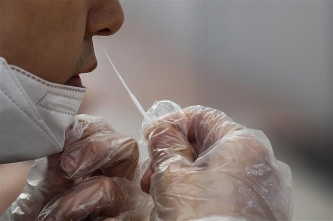 Diễn biến dịch bệnh COVID-19 trái chiều tại Hàn Quốc và Trung Quốc ảnh 1