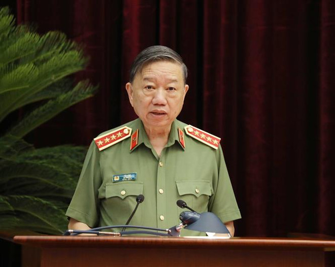 Đại tướng Tô Lâm, Uỷ viên Bộ Chính trị, Bộ trưởng Bộ Công an trình bày báo cáo tại hội nghị. (Ảnh: Phương Hoa/TTXVN) Xây dựng lực lượng CAND đáp ứng yêu cầu, nhiệm vụ trong tình hình mới ảnh 3