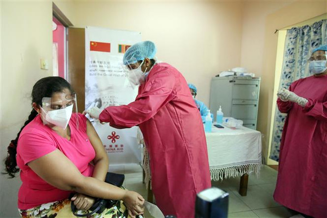 WHO kêu gọi hợp tác toàn cầu trong chia sẻ vaccine COVID-19 ảnh 1