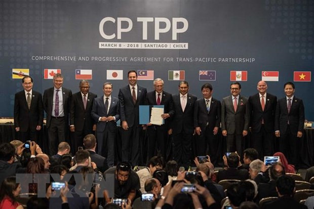 Lễ ký kết Hiệp định CPTPP đã diễn ra tại thủ đô Santiago de Chile năm 2018 dưới sự chủ trì của Tổng thống nước chủ nhà Michelle Bachelet. (Nguồn: THX/TTXVN) Anh gia nhập Hiệp định CPTPP: Cuộc chơi các bên cùng thắng ảnh 1