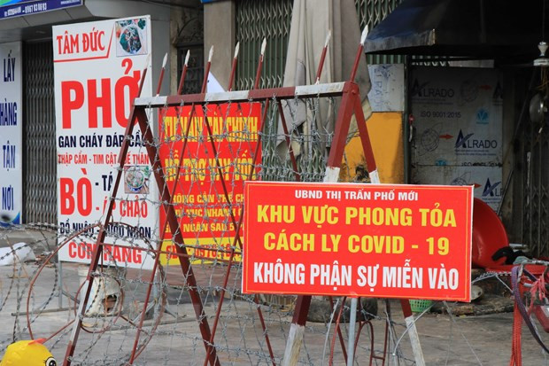 Khu vực bị phong tỏa tại tỉnh Bắc Ninh. (Ảnh: Thanh Thương/TTXVN) Dịch COVID-19: Bắc Ninh tạm dừng dịch vụ ăn, uống tại chỗ từ 29/12 ảnh 1