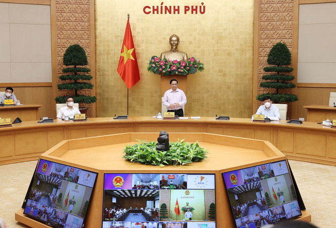 Thủ tướng Phạm Minh Chính họp với tỉnh Kiên Giang và Tiền Giang về công tác phòng, chống dịch COVID-19. (Ảnh: Dương Giang/TTXVN) Đổi mới tác phong làm việc, nắm rõ tình hình cơ sở để chống dịch ảnh 1