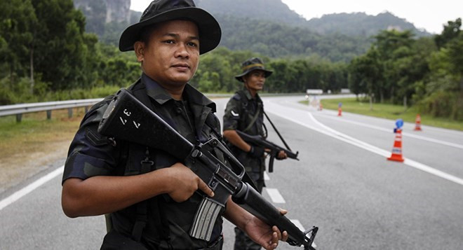 Cảnh sát Malaysia làm nhiệm vụ. (Nguồn: Sputnik) Cảnh sát Malaysia bắt giữ 7 người nghi có liên quan tới IS ảnh 1
