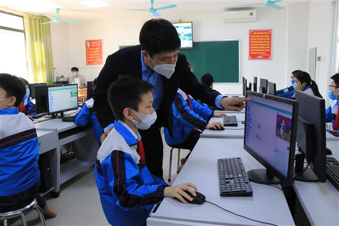 Học sinh trường Tiểu học Suối Hoa (thành phố Bắc Ninh). (Ảnh: Thái Hùng/TTXVN) Bắc Ninh cho phép học sinh đến trường kể từ ngày 21/3 ảnh 1