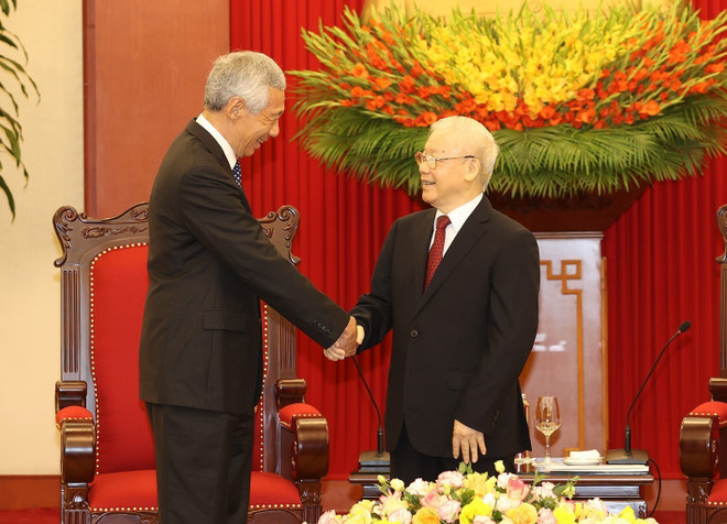 [Photo] Tổng Bí thư Nguyễn Phú Trọng tiếp Thủ tướng Singapore ảnh 1