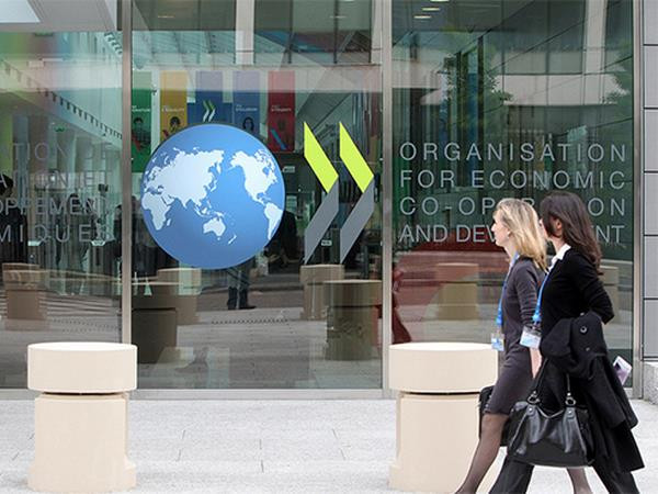 OECD: Tốc độ phục hồi kinh tế toàn cầu phụ thuộc tốc độ tiêm vaccine ảnh 1