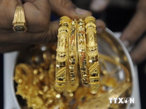 Giá vàng châu Á biến động nhẹ gần mức thấp nhất trong sáu tuần ảnh 1