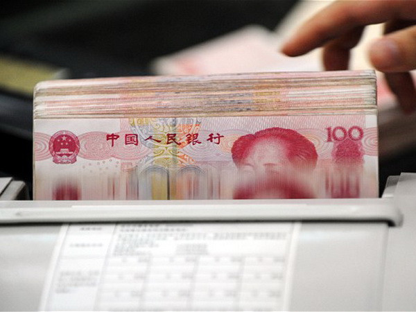 Cảnh sát đã phải sử dụng tới 16 máy đếm tiền. (Nguồn: Getty Images) Một quan chức Trung Quốc tham nhũng 16 triệu USD ảnh 1
