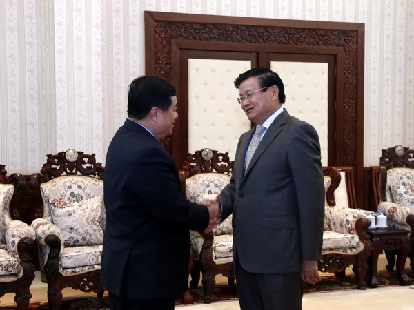 Quang cảnh buổi tiếp. (Ảnh: Phạm Kiên/Vietnam+) Thủ tướng Lào đánh giá cao hoạt động của hai ủy ban hợp tác Lào-Việt ảnh 1