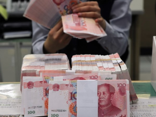 Ảnh minh họa. (Nguồn: AFP/TTXVN) Trung Quốc và những toan tính đằng sau việc phá giá đồng Nhân dân tệ ảnh 1