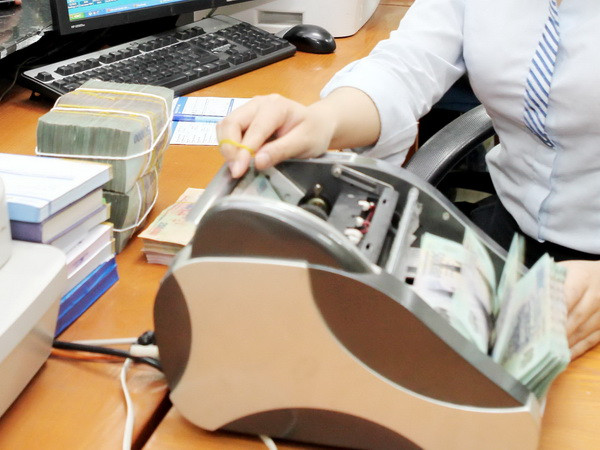 (Ảnh minh họa: Trần Việt/TTXVN) Bắt đầu áp dụng tăng lương tối thiểu vùng từ ngày 1/1/2018 ảnh 1