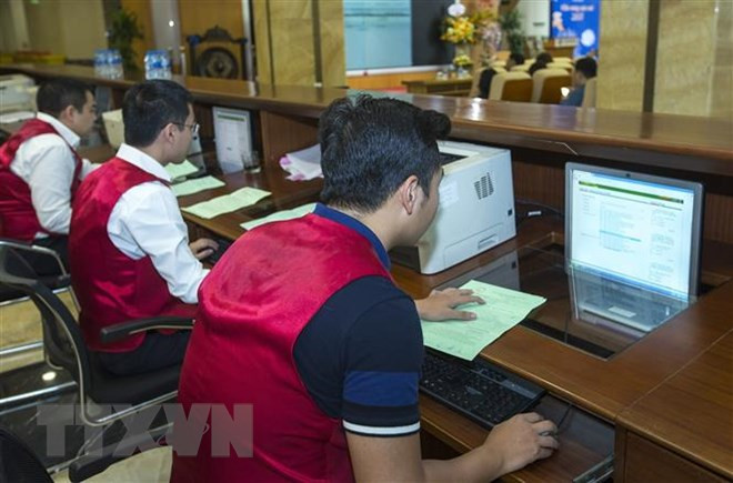 Thống kê từ đầu năm đến nay, kho bạc Nhà nước huy động được 182.410 tỷ đồng trái phiếu Chính phủ. (Ảnh: TTXVN) Lãi suất trái phiếu Chính phủ giảm trên hầu hết các kỳ hạn ảnh 1