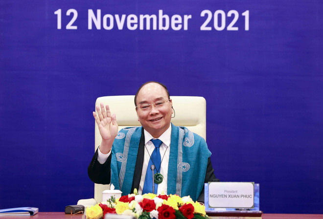 Chủ tịch nước Nguyễn Xuân Phúc tại điểm cầu Hà Nội. (Ảnh: Thống Nhất/TTXVN) APEC cần tiếp tục là động lực tăng trưởng kinh tế toàn cầu ảnh 1