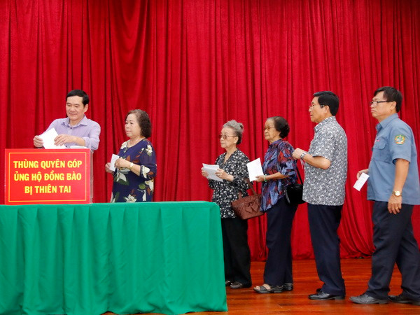 Cộng đồng người Việt tại Lào chung tay giúp bà con bị thiên tai ảnh 1