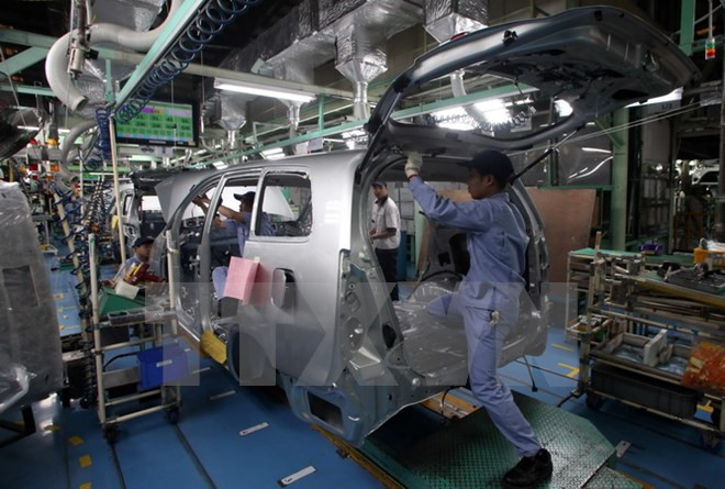 Lắp ráp ôtô tại nhà máy ôtô Toyota Phúc Yên. Ảnh minh họa. (Ảnh: Trần Việt/TTXVN) Giới thiệu kinh tế và môi trường đầu tư Việt Nam tại Osaka ảnh 1