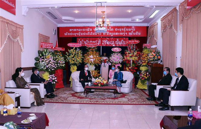 Lãnh đạo Thành phố Hồ Chí Minh chúc mừng Quốc khánh Lào ảnh 1