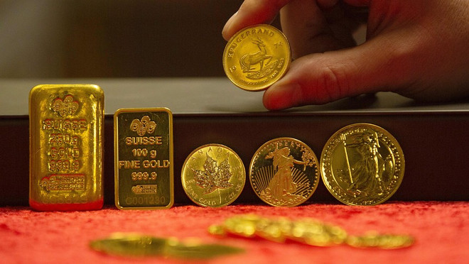 Giá vàng tăng trước những lo ngại về COVID-19. (Nguồn: AFP/Getty Images) Lo ngại COVID-19, giá vàng tăng lên mức cao nhất kể từ năm 2013 ảnh 1