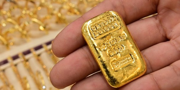 Giá vàng thế giới tăng. (Nguồn: AP) Giá vàng tăng do lo ngại về số ca nhiễm biến thể Delta ảnh 1