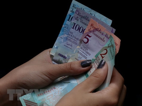 Venezuela loại đồng USD khỏi thị trường hối đoái nhằm trả đũa Mỹ ảnh 1