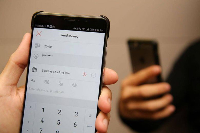 (Nguồn: straitstimes.com) Singapore: Người dân có thể thanh toán điện tử mọi dịch vụ công ảnh 1
