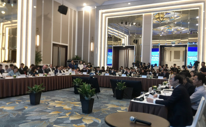 Toàn cảnh hội thảo. (Ảnh: PV/Vietnam+) Tìm cách giữ chân ‘đại bàng’ khi thuế tối thiểu toàn cầu được áp dụng ảnh 2