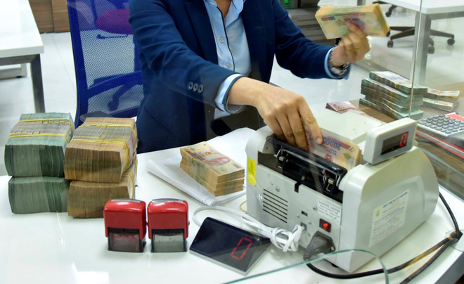 Hoạt động ngân hàng trong quý 1: Lợi nhuận sụt giảm, nợ xấu tăng vọt ảnh 1