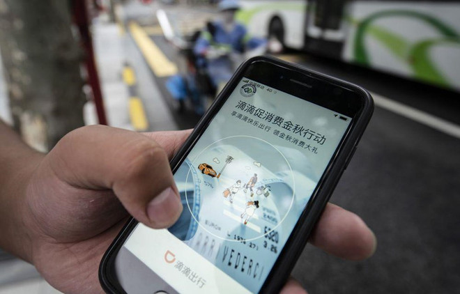 Ứng dụng đặt xe của Didi Global Inc trên điện thoại tại Trung Quốc. (Nguồn: Bloomberg) Trung Quốc muốn "tách rời" các công ty trong nước với phương Tây ảnh 1