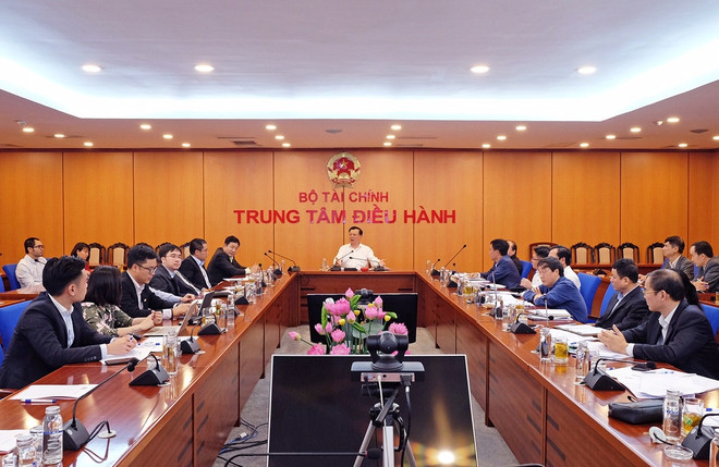 Bộ trưởng Bộ tài chính Đinh Tiến Dũng chủ trì buổi làm việc. (Ảnh: Vietnam+) Bộ Tài chính quyết tâm xử lý tình trạng nghẽn lệnh chứng khoán ảnh 1