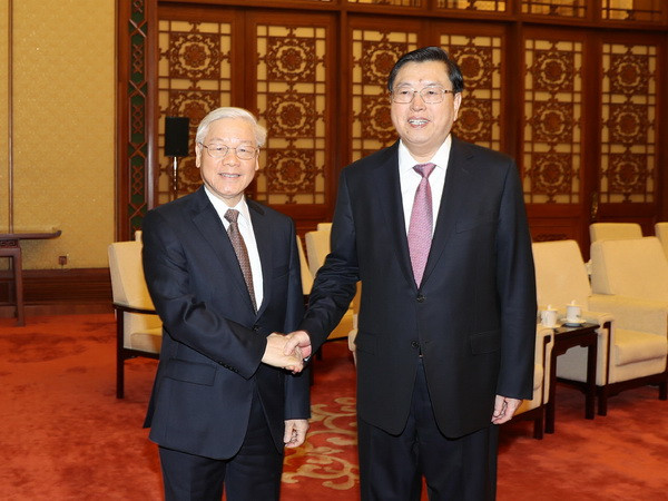 Tổng Bí thư hội kiến Ủy viên trưởng Nhân đại Trung Quốc ảnh 1