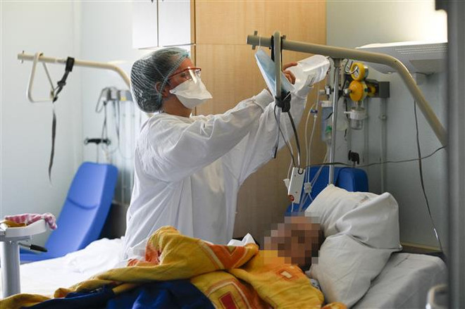 Dịch COVID-19 sáng 19/2: Mỹ ghi nhận số ca tử vong cao nhất thế giới ảnh 1