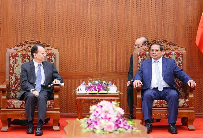 Thủ tướng Phạm Minh Chính tiếp ông Masatsugu Asakawa, Chủ tịch Ngân hàng Phát triển châu Á. (Ảnh: Dương Giang/TTXVN) TTXVN_1303ThutuongADB3.jpg