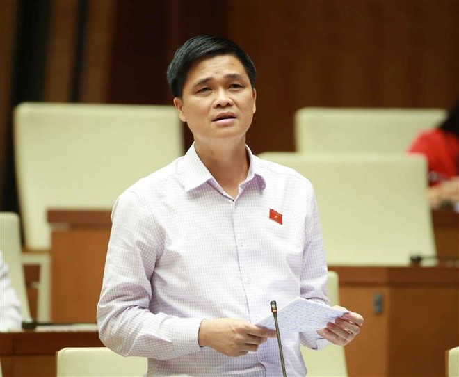 Đại biểu Quốc hội Thành phố Hà Nội Ngọ Duy Hiểu phát biểu ý kiến. (Ảnh: Doãn Tấn/ TTXVN) Người lao động làm công việc nặng nhọc có thể được nghỉ hưu sớm ảnh 1