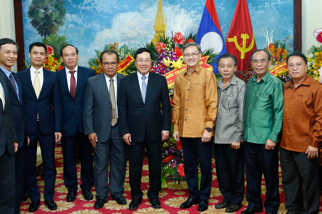 Phó Thủ tướng Phạm Bình Minh chúc mừng Tết cổ truyền Bunpimay của Lào ảnh 1