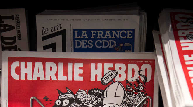 Charlie Hebdo bị chỉ trích thậm tệ vì vẽ tranh chế nhạo em bé Syria ảnh 1
