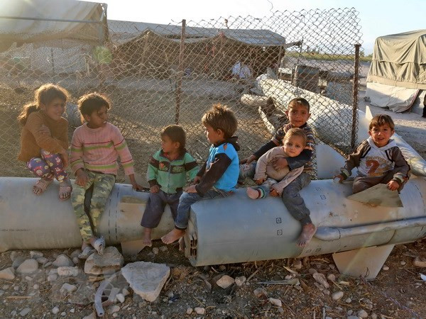 Trẻ em Syria tại trại tị nạn Ash'ari , khu vực Đông Ghouta. (Nguồn: AFP/TTXVN) Sự kiện quốc tế 23-29/4: Bước chân lịch sử của ông Kim Jong-un ảnh 3
